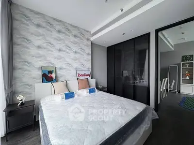 Modern bedroom with stylish decor and large bed in contemporary apartment