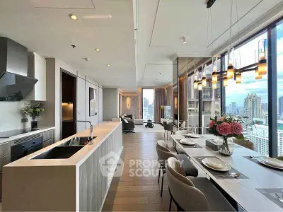 Luxurious open-plan kitchen and dining area with stunning city views, modern appliances, and elegant decor.