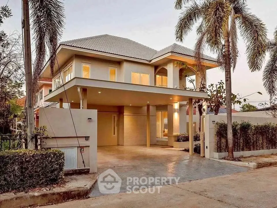 Stunning modern two-story house with spacious driveway and palm trees