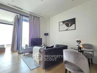 Modern living room with stylish decor and balcony access in a luxury apartment.