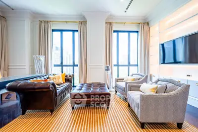 Luxurious living room with elegant furniture and large windows offering city views.