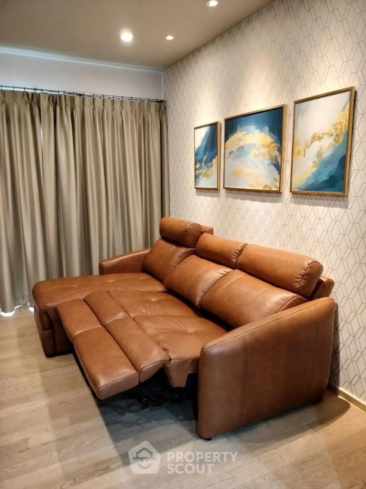 Luxurious living room with leather recliner sofa and elegant wall art