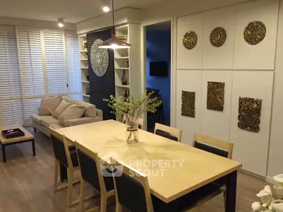 Stylish living room with modern decor and spacious dining area