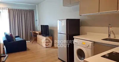 Modern apartment interior with kitchen, living area, and appliances, ideal for urban living.