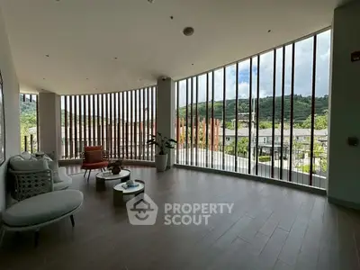 Spacious living area with scenic view and modern decor