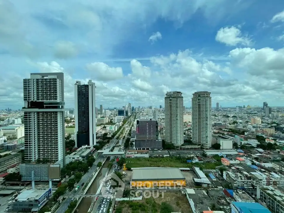 Stunning cityscape view showcasing modern high-rise buildings under a vibrant blue sky.