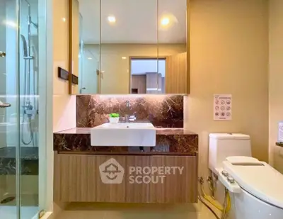 Luxurious modern bathroom with elegant marble accents and sleek fixtures