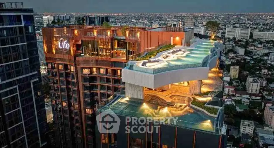 Stunning rooftop pool with panoramic city views at luxury high-rise building.