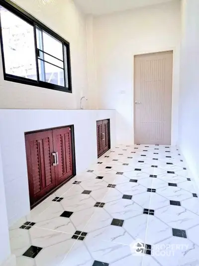 Modern kitchen with sleek cabinetry and stylish tile flooring