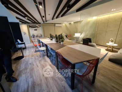 Modern open-plan living area with stylish decor and ample seating