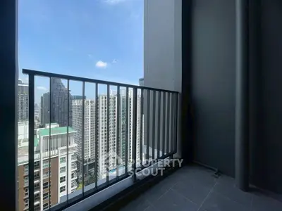 Stunning high-rise balcony view overlooking city skyline, perfect for urban living.