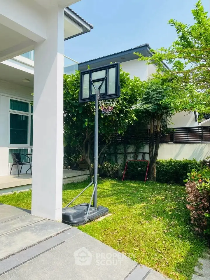Charming garden with basketball hoop in modern residential property