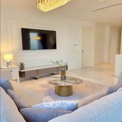 Luxurious living room with elegant chandelier and modern decor