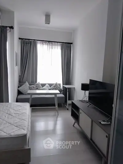 Modern studio apartment with cozy living area and stylish decor