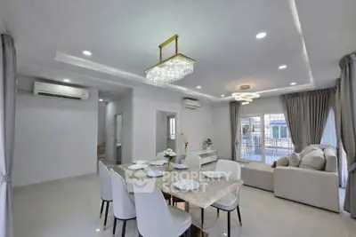 Spacious modern living room with elegant dining area and natural light