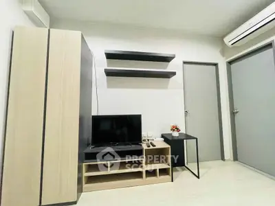 Modern living room with sleek TV stand, wall shelves, and air conditioning in a minimalist design.