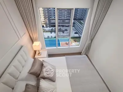 Luxurious bedroom with pool view in modern high-rise apartment