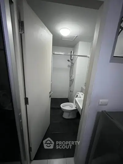 Compact bathroom with modern fixtures and sleek design, ideal for urban living spaces.