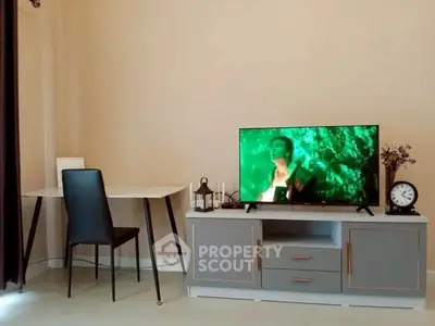 Modern living room with sleek TV stand and stylish desk setup