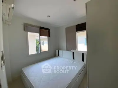 Cozy bedroom with natural light and modern design