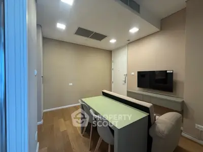 Modern living room with sleek furniture and wall-mounted TV