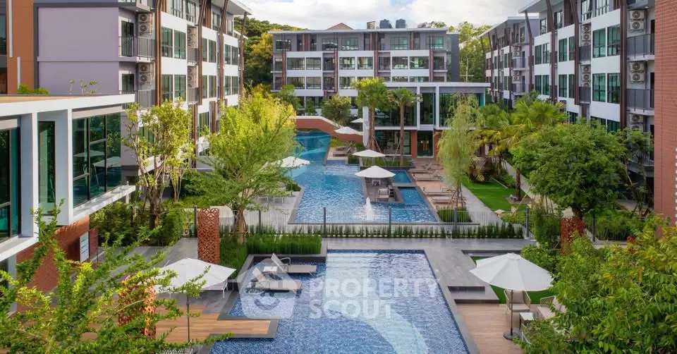Luxurious apartment complex with stunning pool and lush greenery, perfect for modern living.