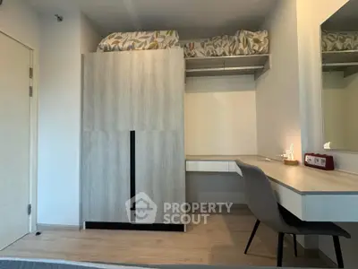 Modern bedroom with stylish wardrobe and cozy workspace