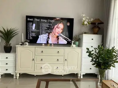 Charming living room with elegant white furniture and decorative plants