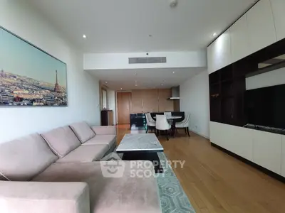 Spacious modern living room with elegant decor and open dining area