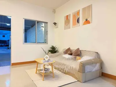Modern living room with stylish decor and cozy sofa in a bright, inviting space.