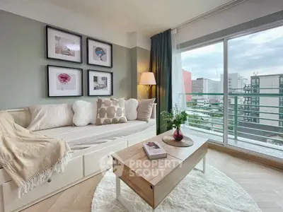 Stylish living room with cozy decor and city view from large window.