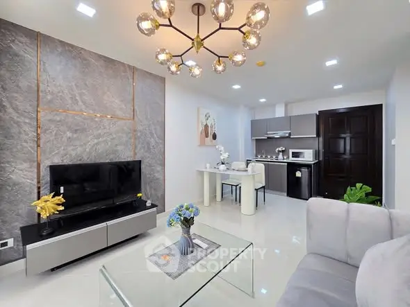 Modern living room with stylish decor and open kitchen layout