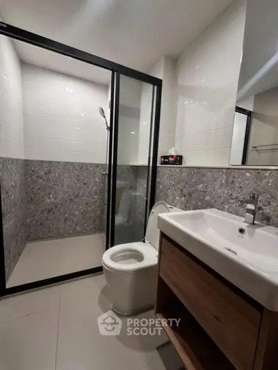 Modern bathroom with sleek design and glass shower enclosure