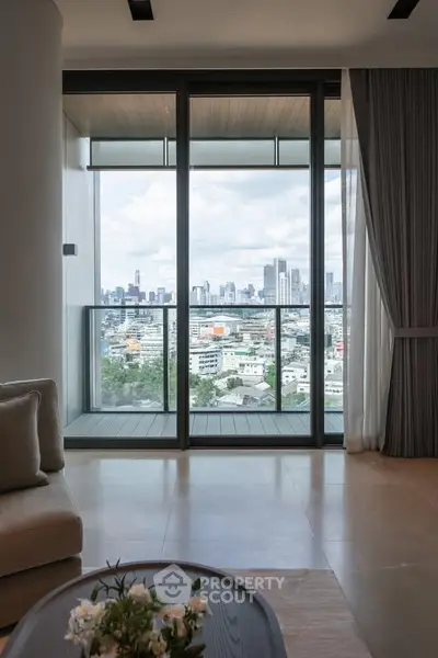 Stunning high-rise apartment with floor-to-ceiling windows offering breathtaking city views.