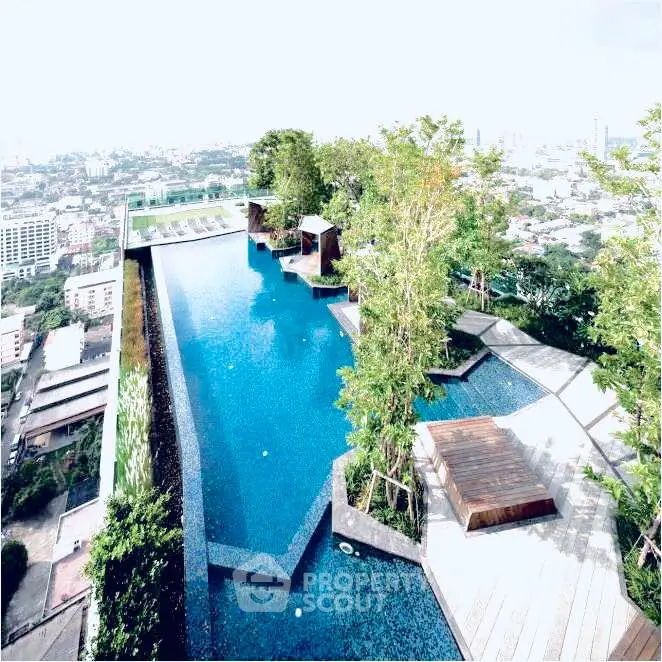 Stunning rooftop infinity pool with panoramic city views and lush greenery.