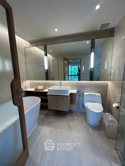 Luxurious modern bathroom with freestanding bathtub and elegant fixtures