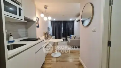 Modern apartment interior with open kitchen and cozy living area