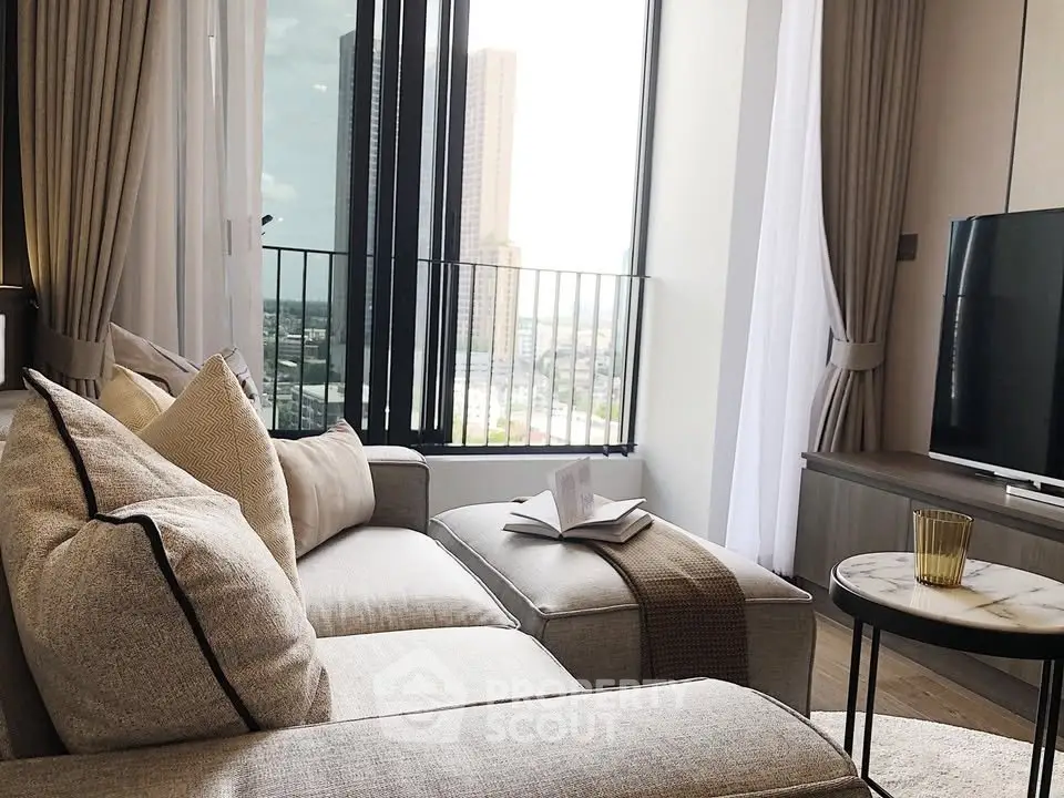 Luxurious living room with modern decor and stunning city view from large windows.