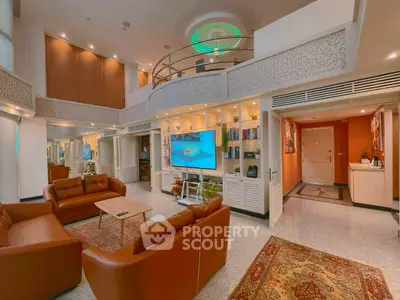 Luxurious living room with high ceilings, elegant decor, and modern furnishings in a spacious open layout.