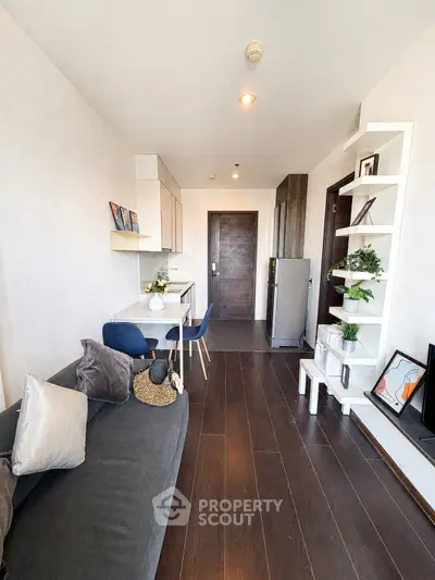 Modern living room with sleek furniture and stylish decor in a contemporary apartment.
