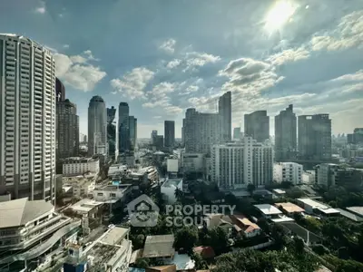 Stunning cityscape view of modern skyscrapers under a bright sky, showcasing urban living at its finest.