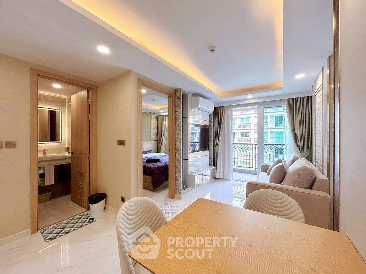 Modern open-plan living room with dining area and balcony view