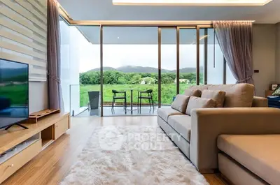 Luxurious living room with stunning view and spacious balcony in modern apartment.
