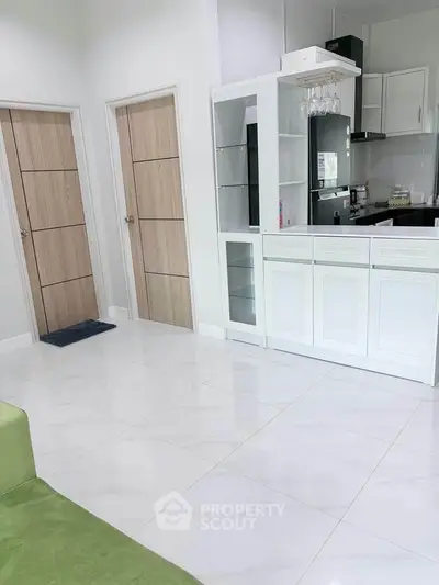 Modern kitchen with sleek cabinetry and open layout in bright apartment
