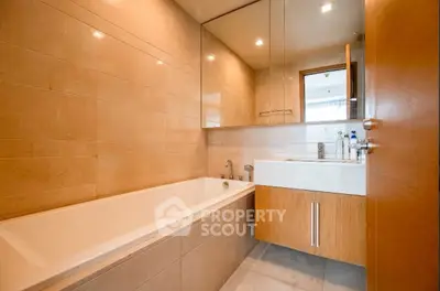 Modern bathroom with sleek design and built-in bathtub in luxury apartment