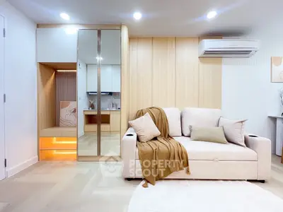 Modern living room with cozy beige sofa and stylish decor