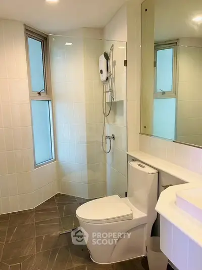 Modern bathroom with sleek fixtures and glass shower enclosure