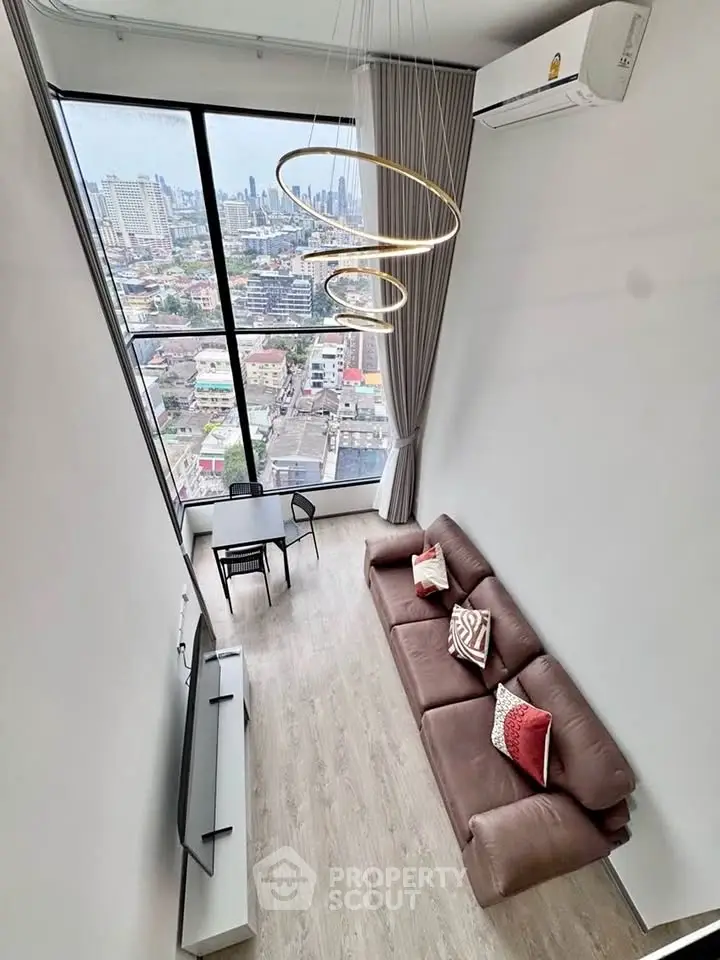 Stunning high-rise living room with panoramic city view and modern decor