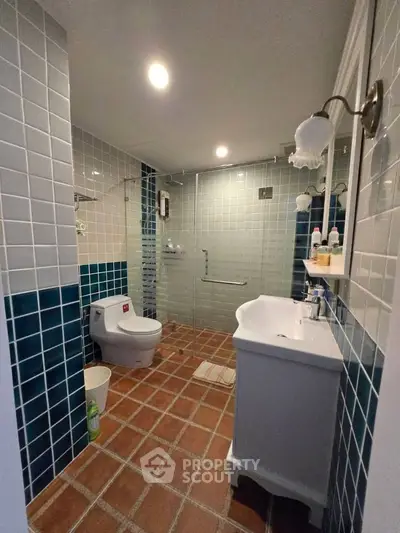 Charming bathroom with modern fixtures and stylish tile design, perfect for a cozy home retreat.