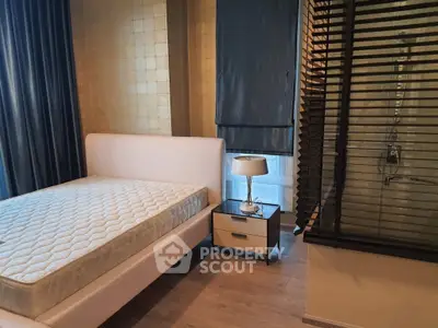 Modern bedroom with stylish decor and natural light